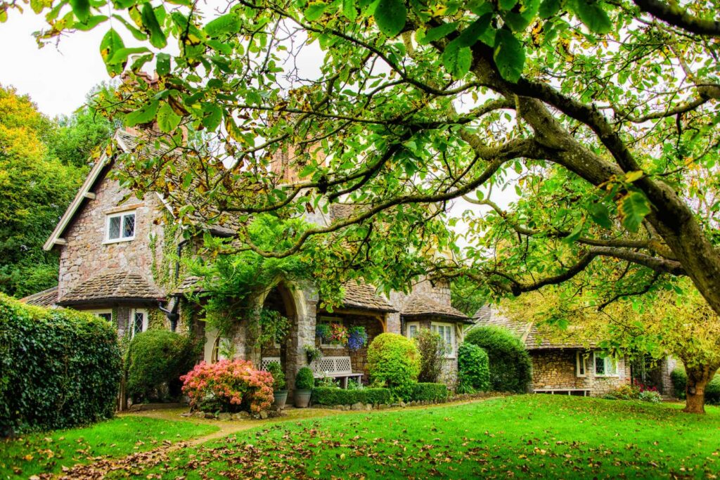 english countryside cottage amongst beautiful trees and gardens