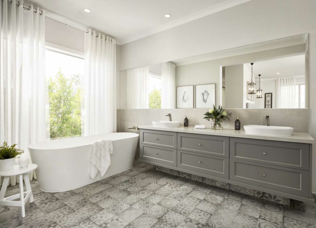 traditional style bathroom renovation with freestanding bath and double sink basins